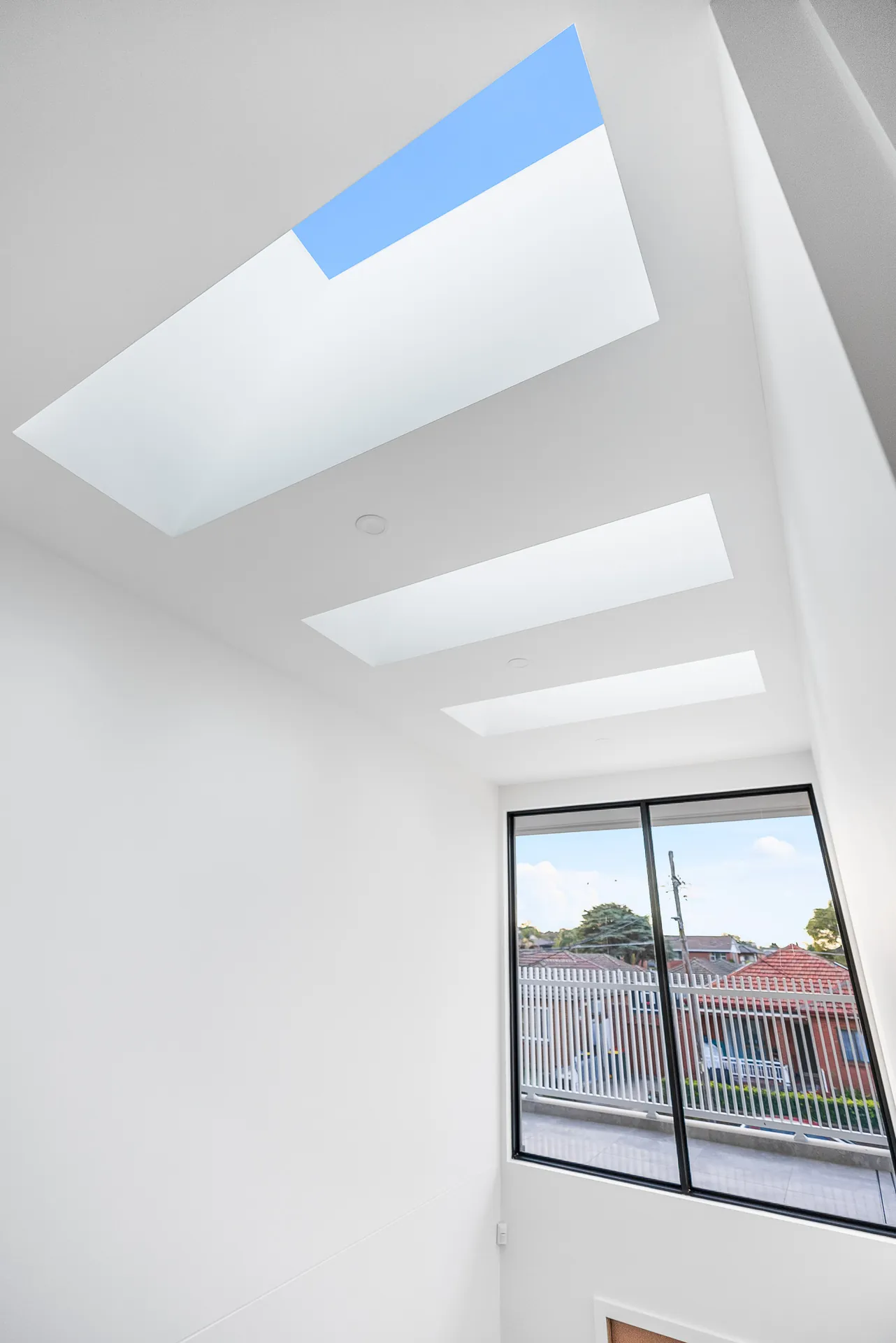 Skylights bringing natural light into the double-height void of the Scott home