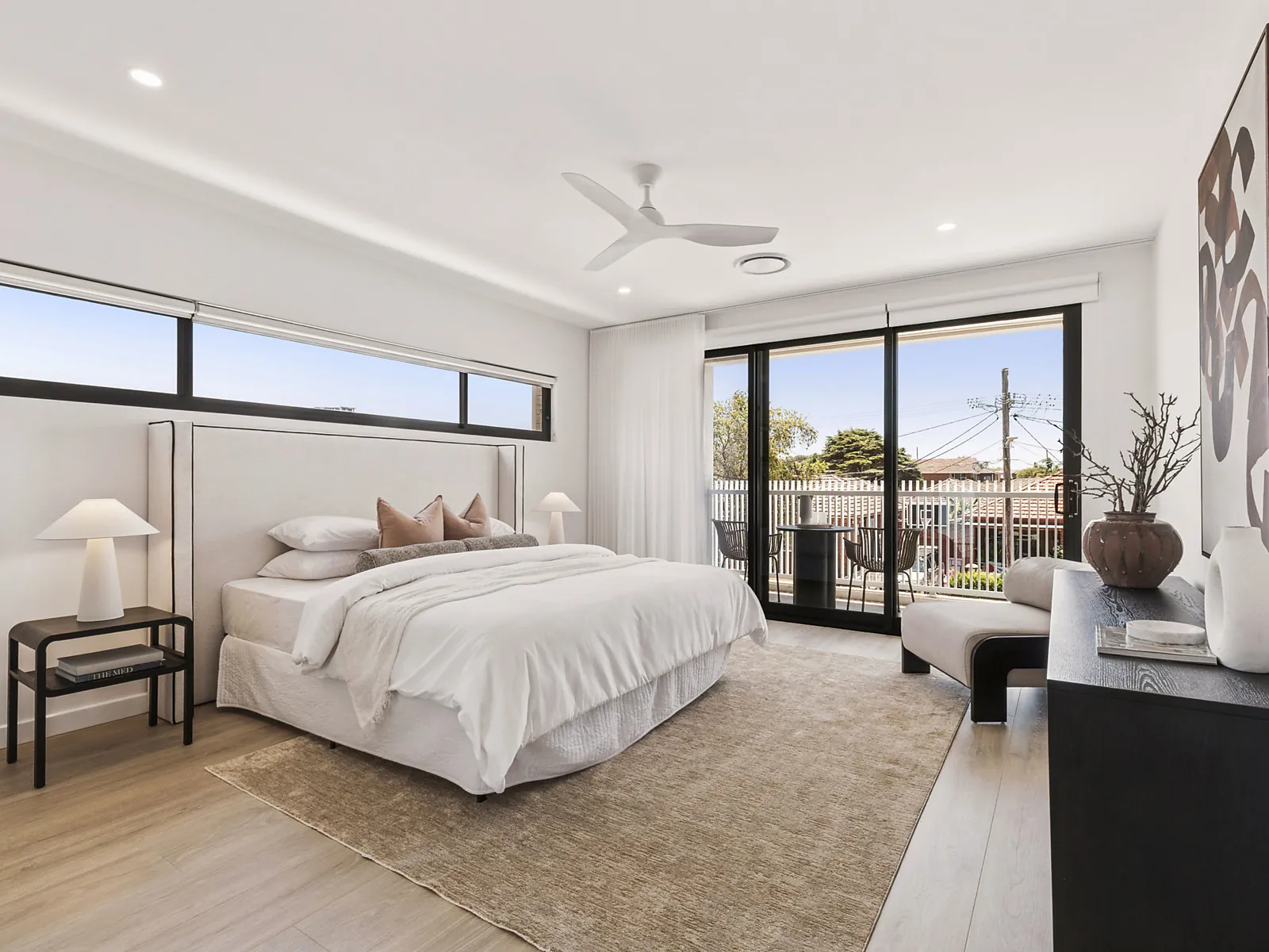 Main bedroom with balcony access in the Scott custom home